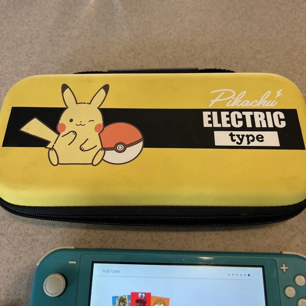 Nintendo Switch Lite Handheld Teal with Pikachu Case One Game And Console Case